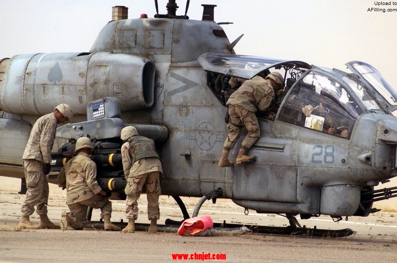 US_Navy_030414-M-5654R-026_Weapons_are_loaded_onto_an_AH-1A_Cobra_lands_for_a_refueling_near_Tikrit,_Iraq_where_Marine_Wing_Support_Squadron_Three_Seventy_Three_%28MWSS-373%29_has_set_up_a_Forw.jpg