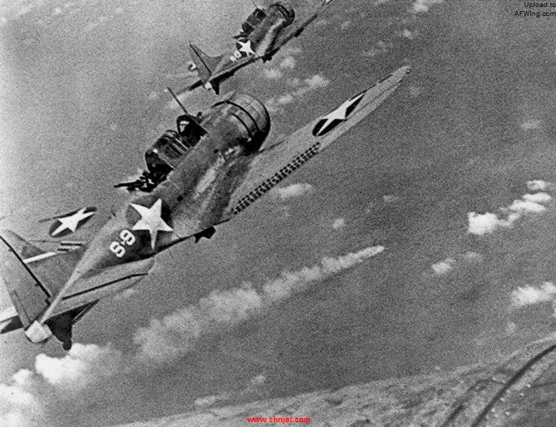 SBD-3_Dauntless_bombers_of_VS-8_over_the_burning_Japanese_cruiser_Mikuma_on_6_June_1942.jpg