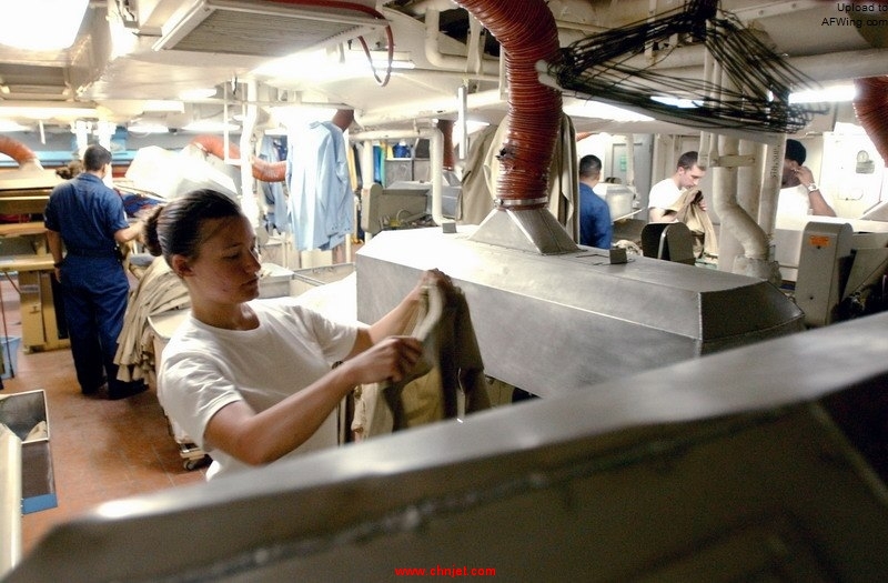 US_Navy_060519-N-5549O-082_Airman_Jacqueline_Pfeffer_prepares_to_press_a_uniform_in_the_ship%27s_laundry_aboard_the_Nimitz-class_aircraft_carrier_USS_Ronald_Reagan_%28CVN_76%29.jpg